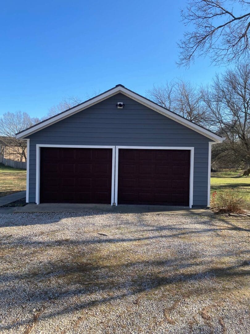 A garage with two doors and no windows.