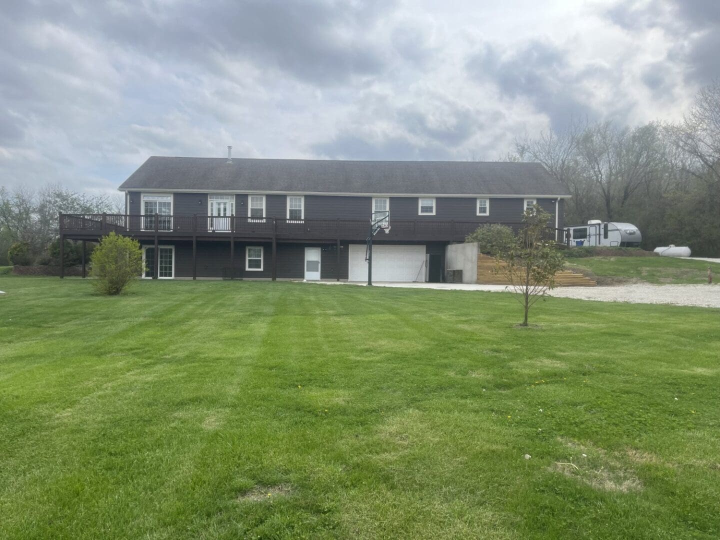 A large house with a lot of grass in front