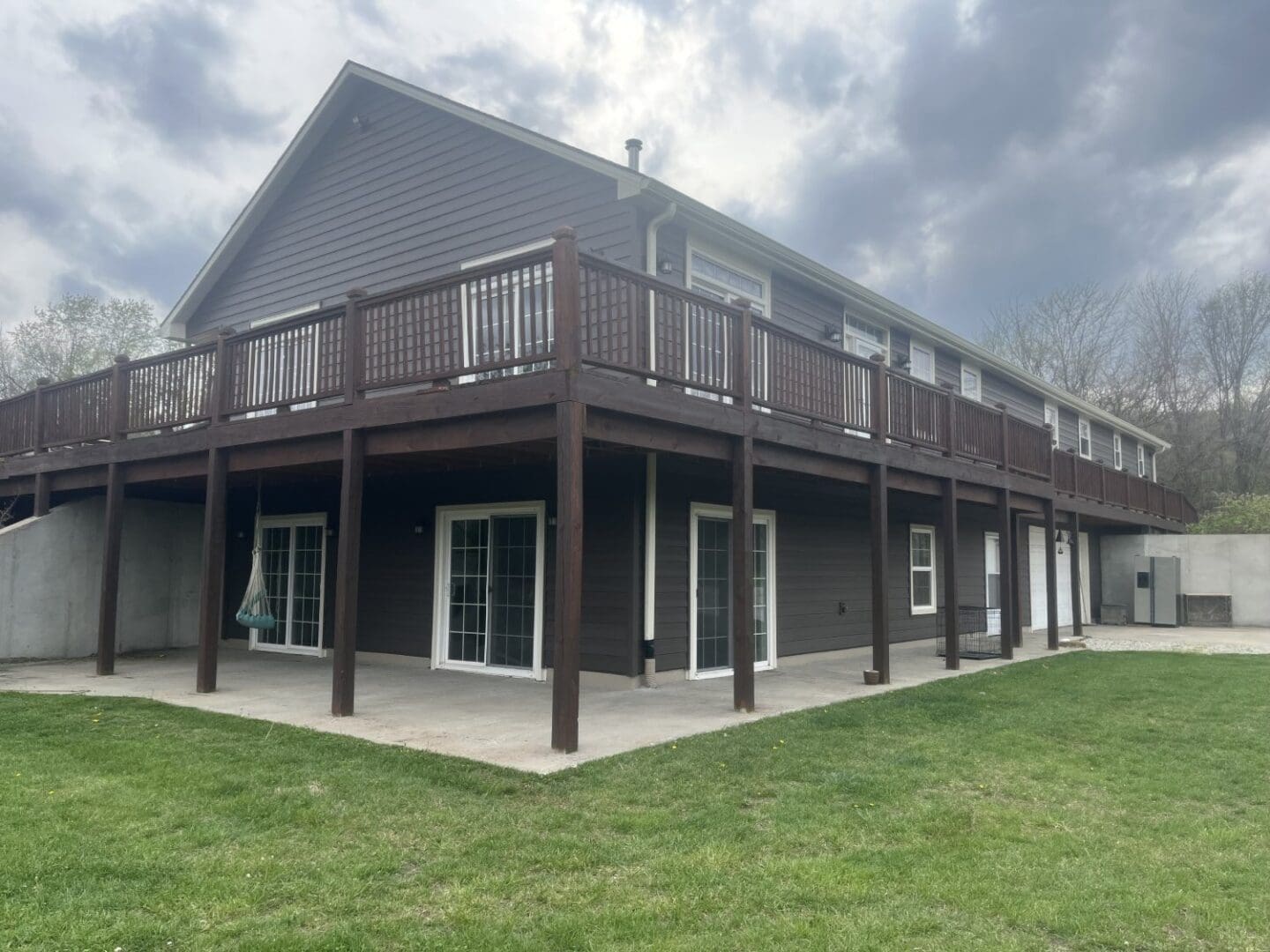 A large building with lots of windows and a porch.