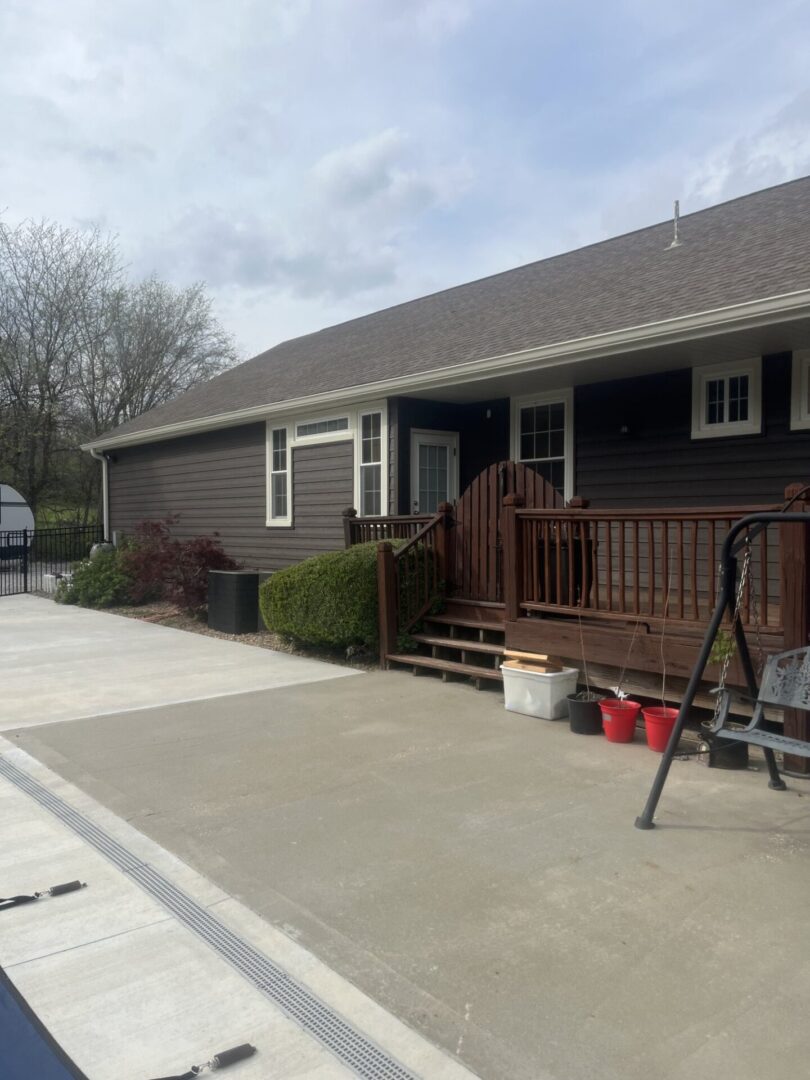 A house with a driveway and a bike rack.