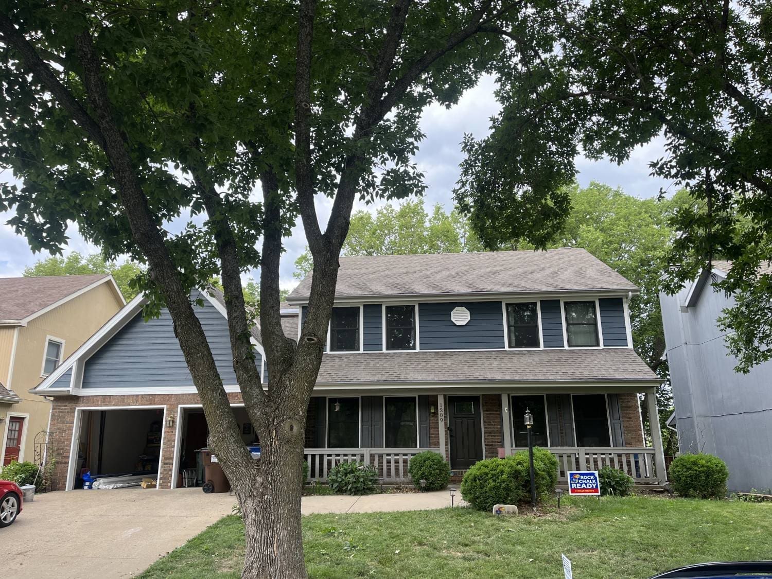 A house with a tree in front of it