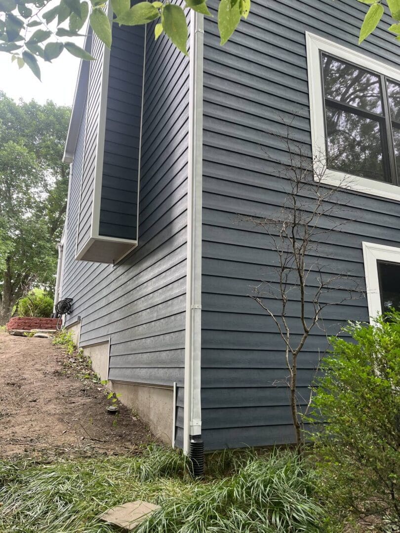 A house with blue siding and white trim.