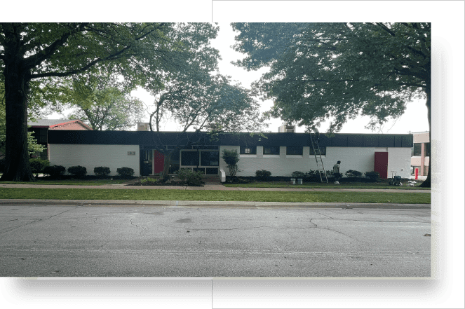 A large building with trees in the background