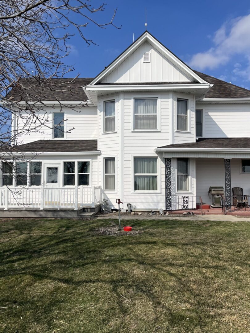 White House with 6 windows and porch